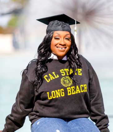 Graduate Janay Taylor in ɫ sweatshirt and cap
